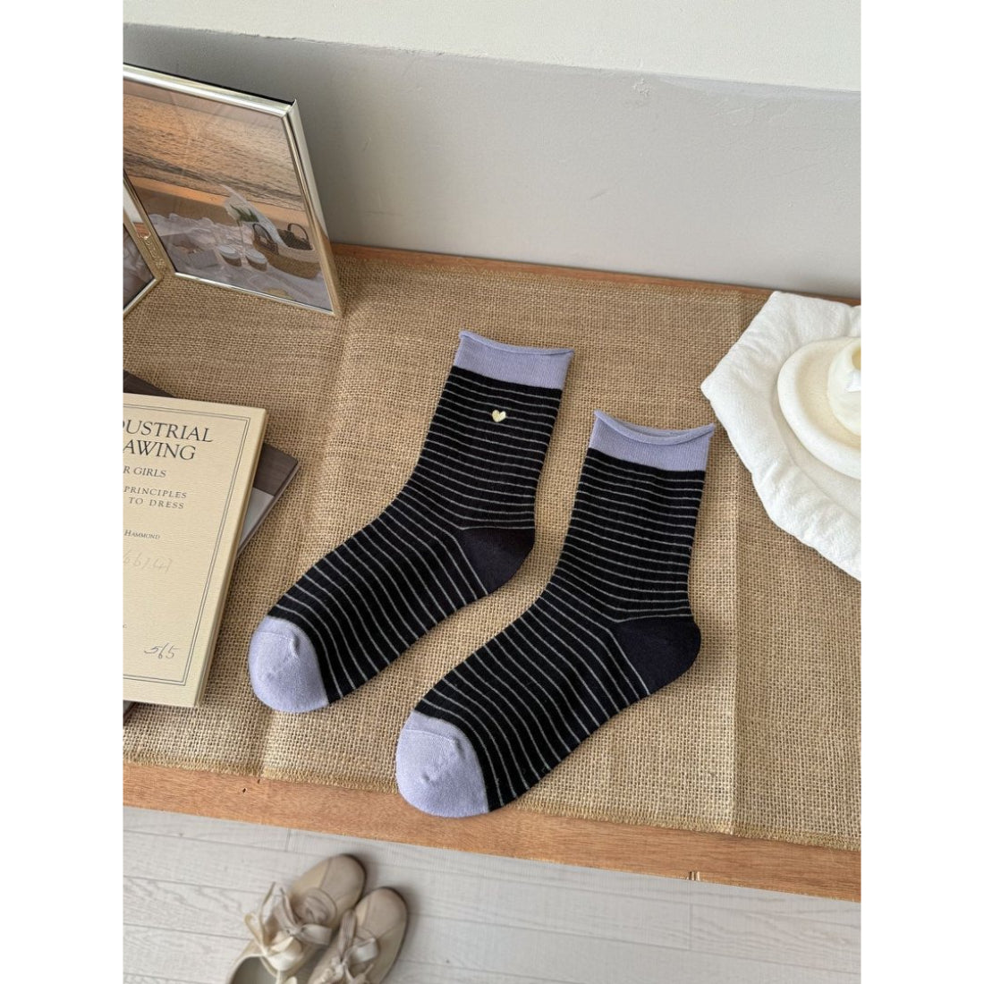 Model wearing Rufia Everyday Stripe Heart Socks with casual shoes and rolled-up jeans