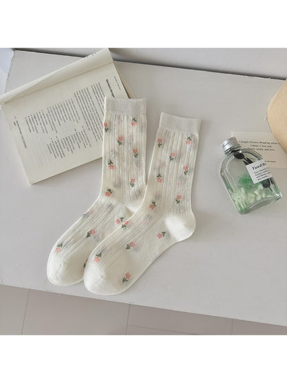 Rufia socks displayed flat showing full ditsy floral pattern and ribbing