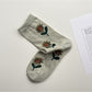 Rufia crew socks in blue floral styling