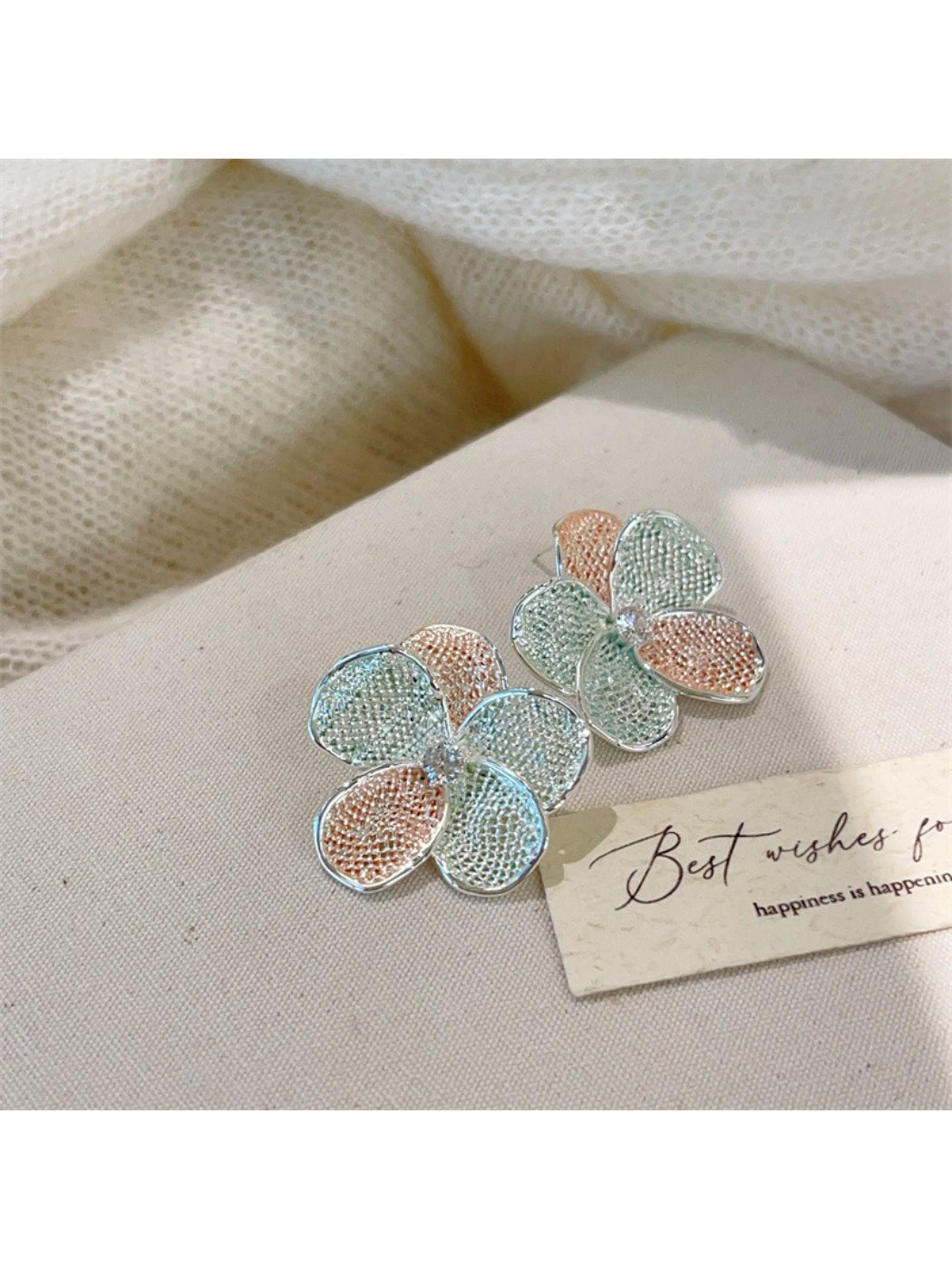 Earwish multicolor floral cluster earrings arranged with matching accessories