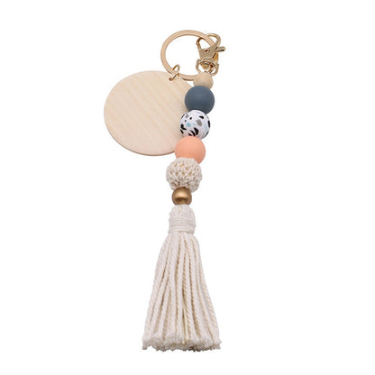 Koco Round Wood Bead Tassel Keychain with tassel detail