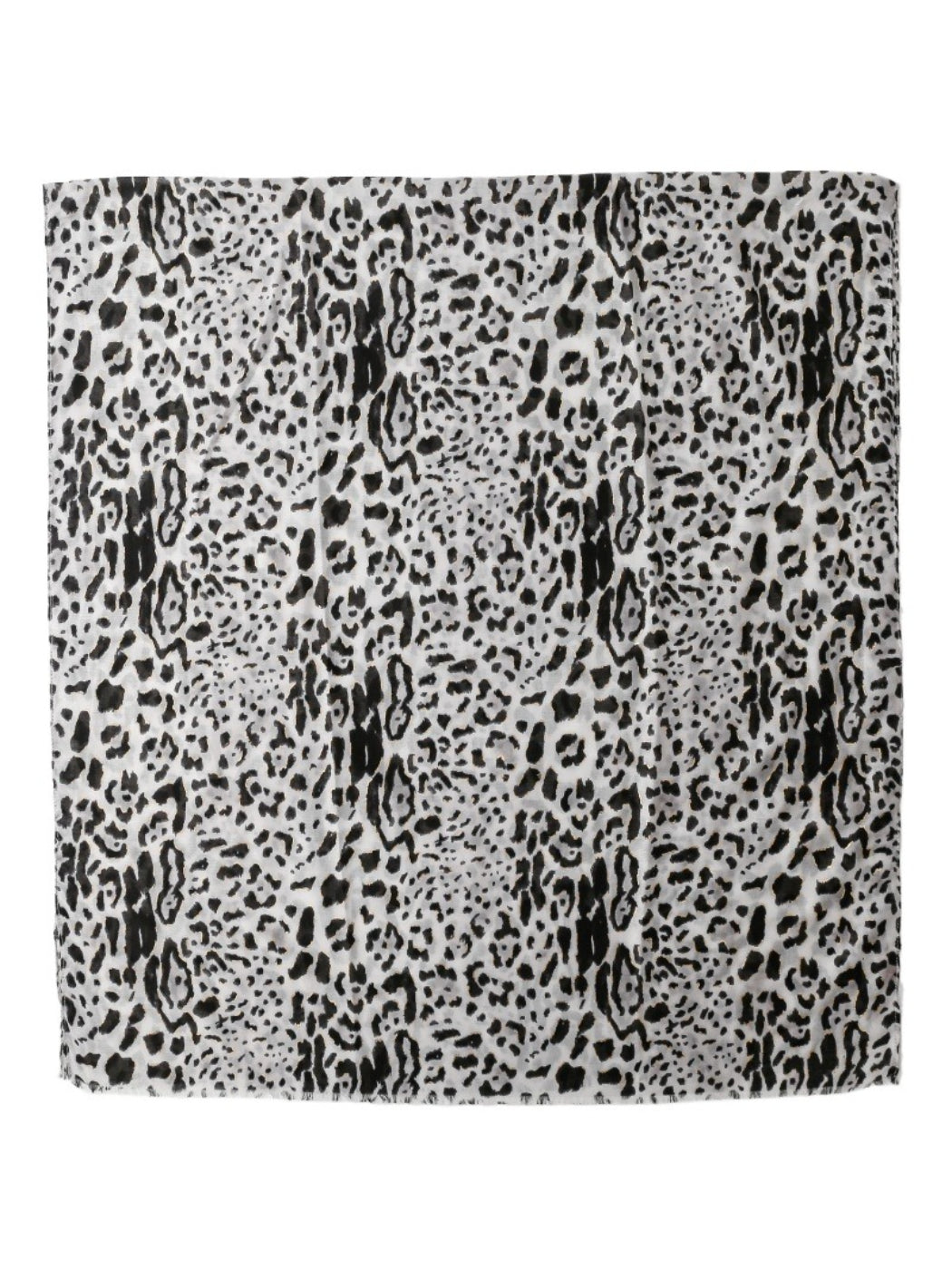 Model wearing snow leopard print scarf draped around neck