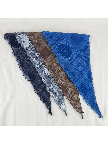 Soft paisley triangle head scarf folded on a white background