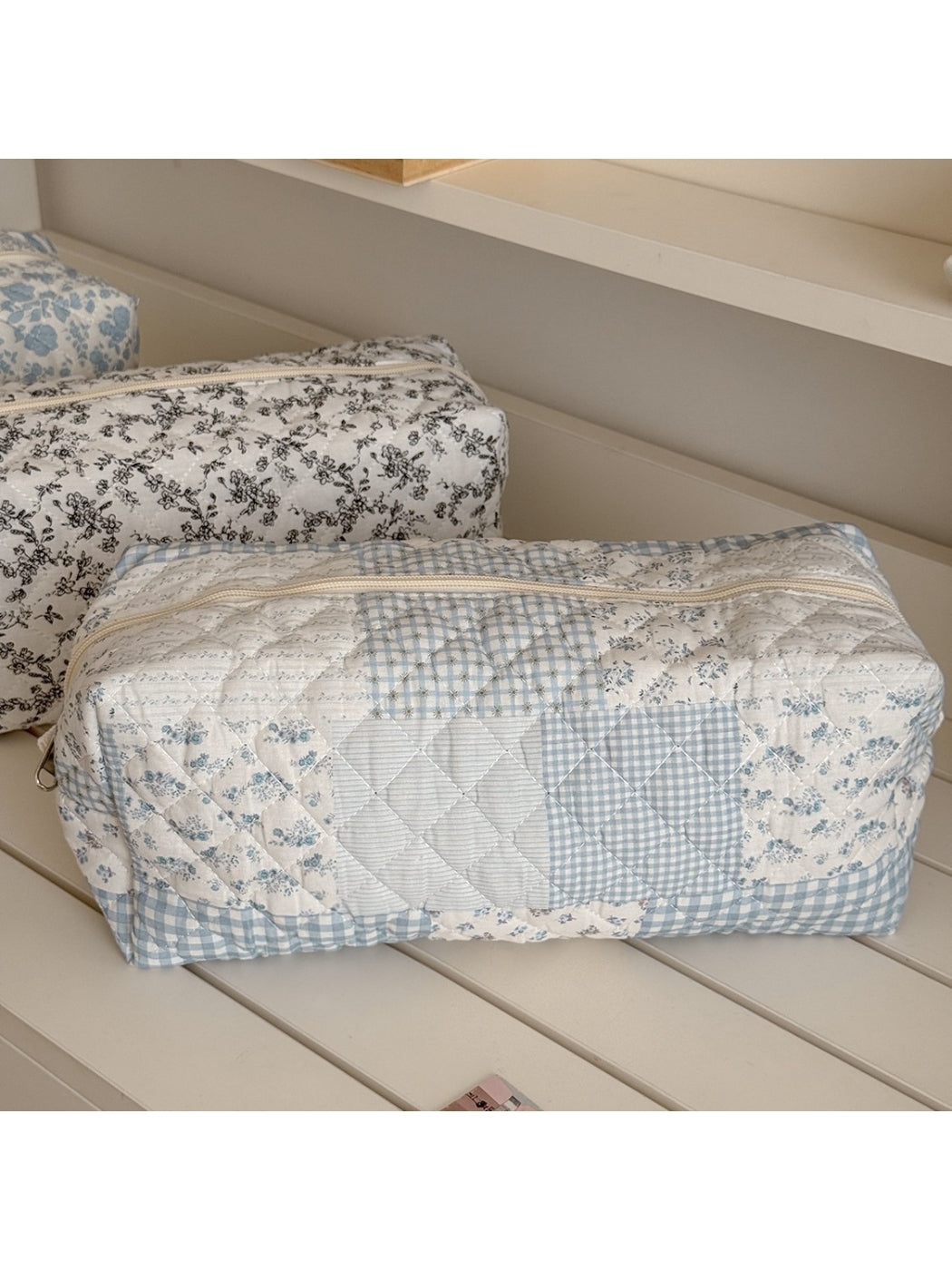 Cosbai cosmetic pouch open showing spacious interior with floral design