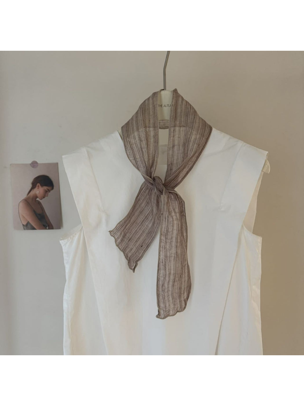 Close-up of gingham and stripe pattern on Scarvii skinny scarf fabric