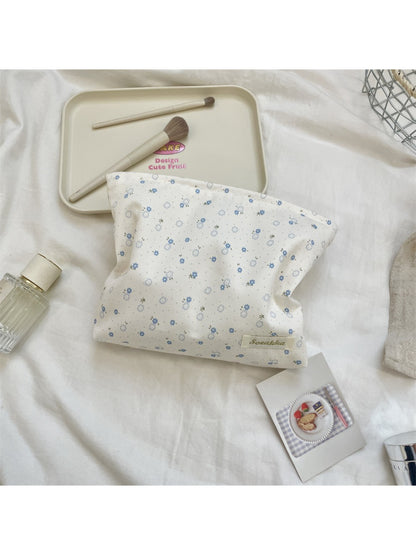 Side view of Cosbai Ditsy Floral Cosmetic Pouch highlighting fabric texture and stitching