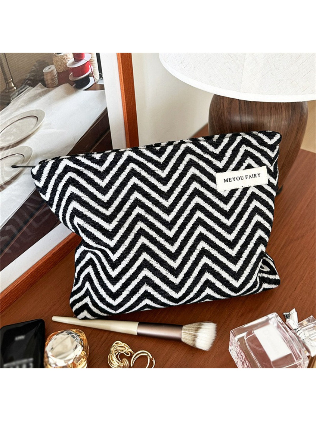 Close-up of Cosbai Zigzag Print Zip Pouch showing detailed zigzag design and zipper