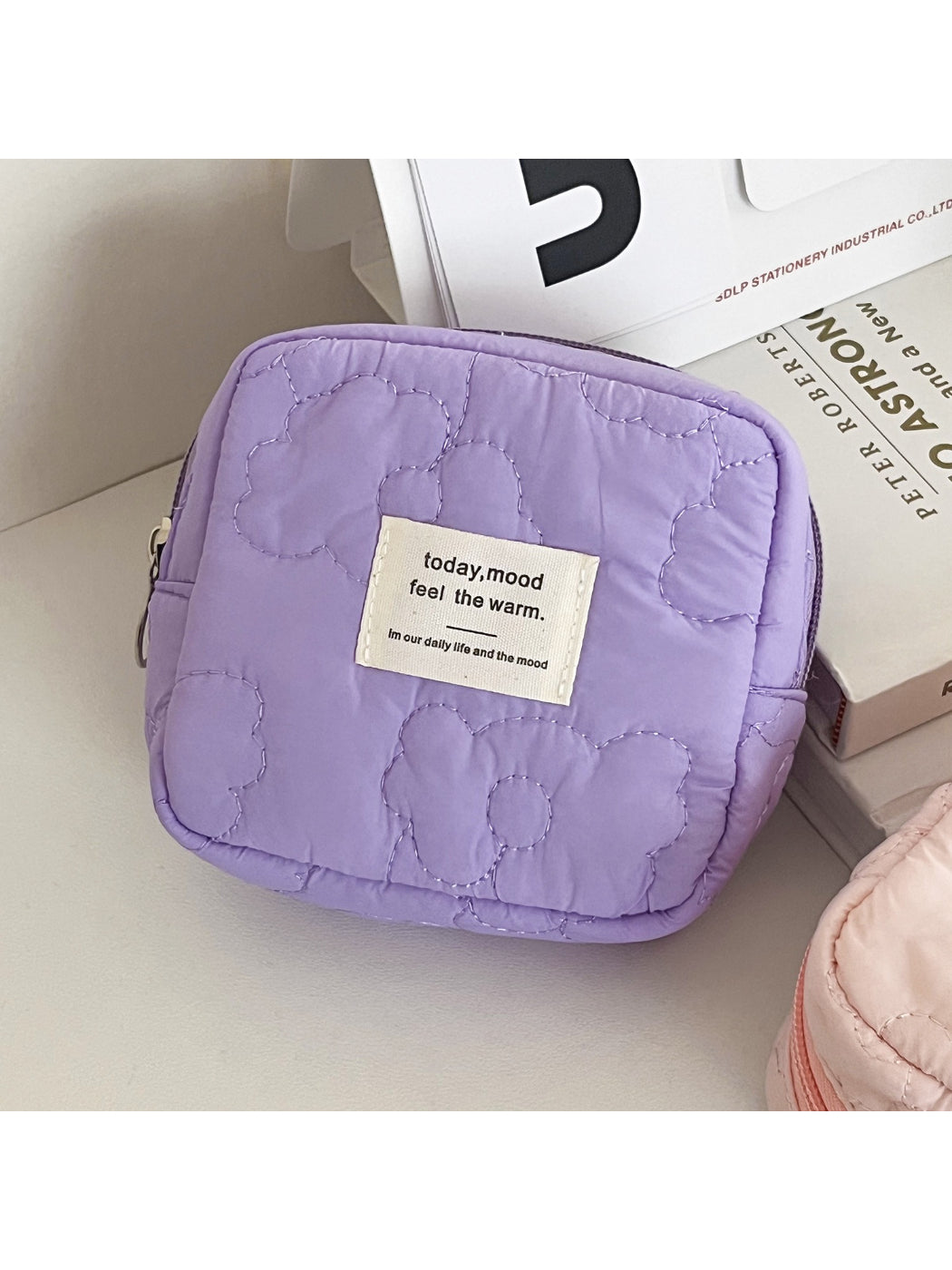 Cosbai cosmetic bag placed on a vanity table with makeup items inside