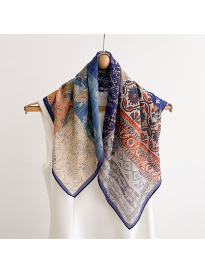 Scarvii square scarf styled around a mannequin neck