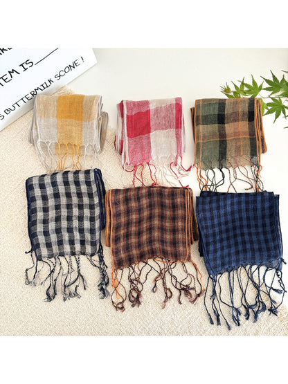Soft check pattern long skinny scarf laid flat showing full length and pattern