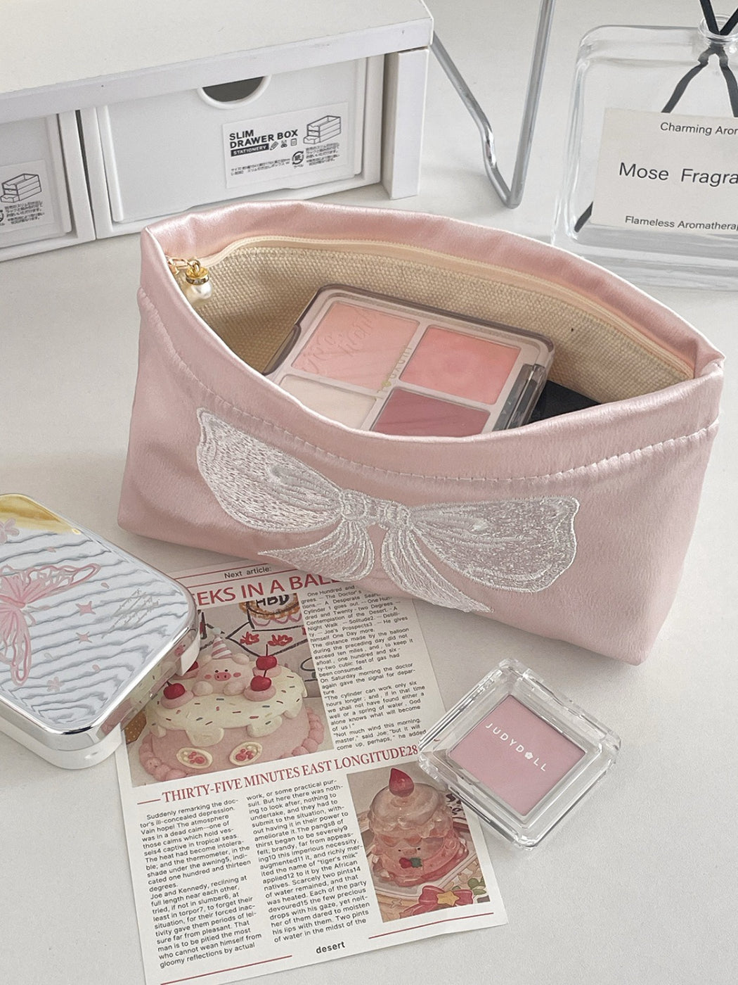 Cosbai elegant bow cosmetic pouch displayed alongside matching accessories