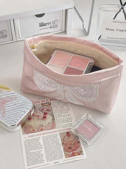 Cosbai elegant bow cosmetic pouch displayed alongside matching accessories