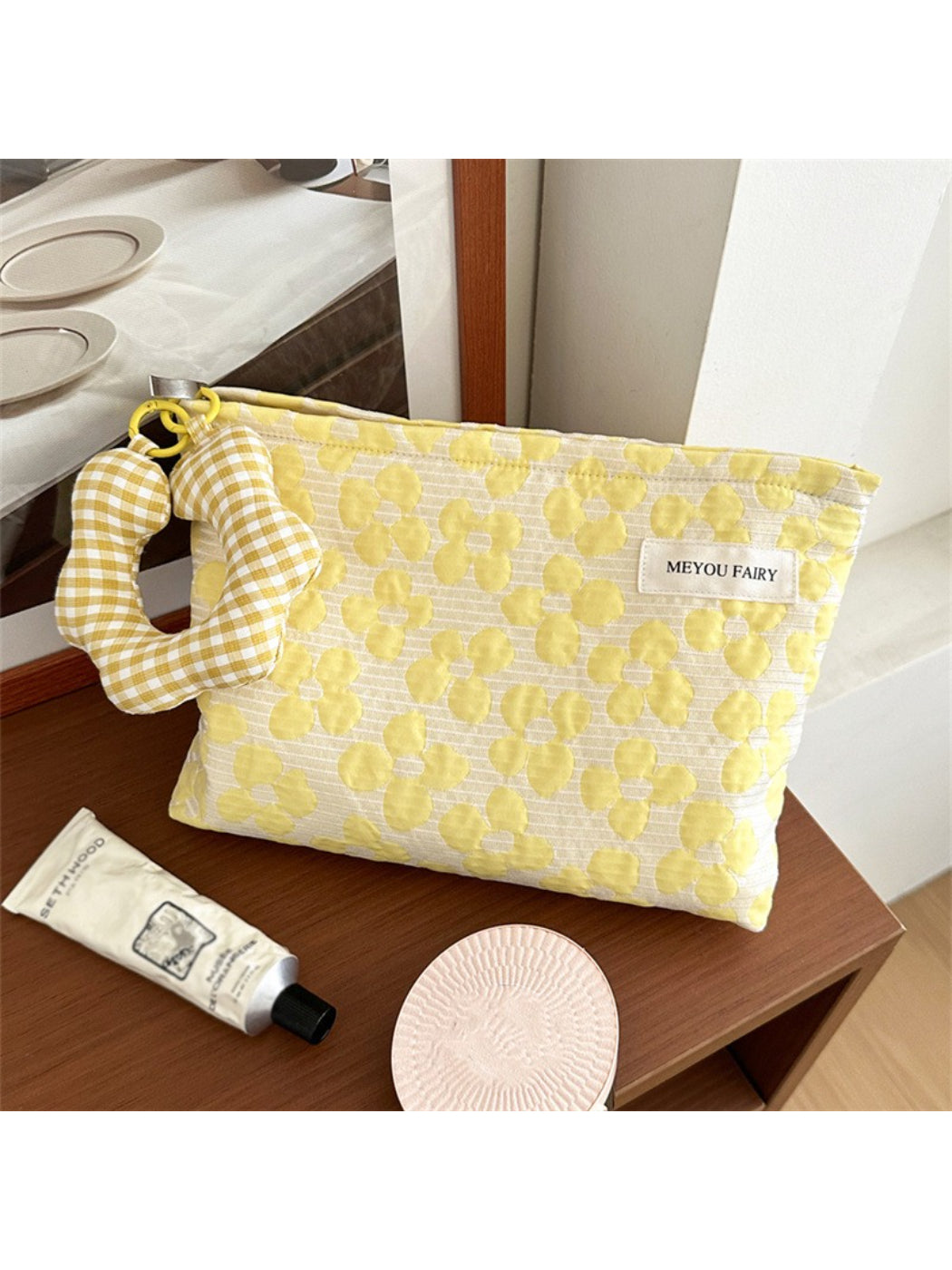 Side view of Cosbai floral cosmetic pouch highlighting fabric texture and stitching