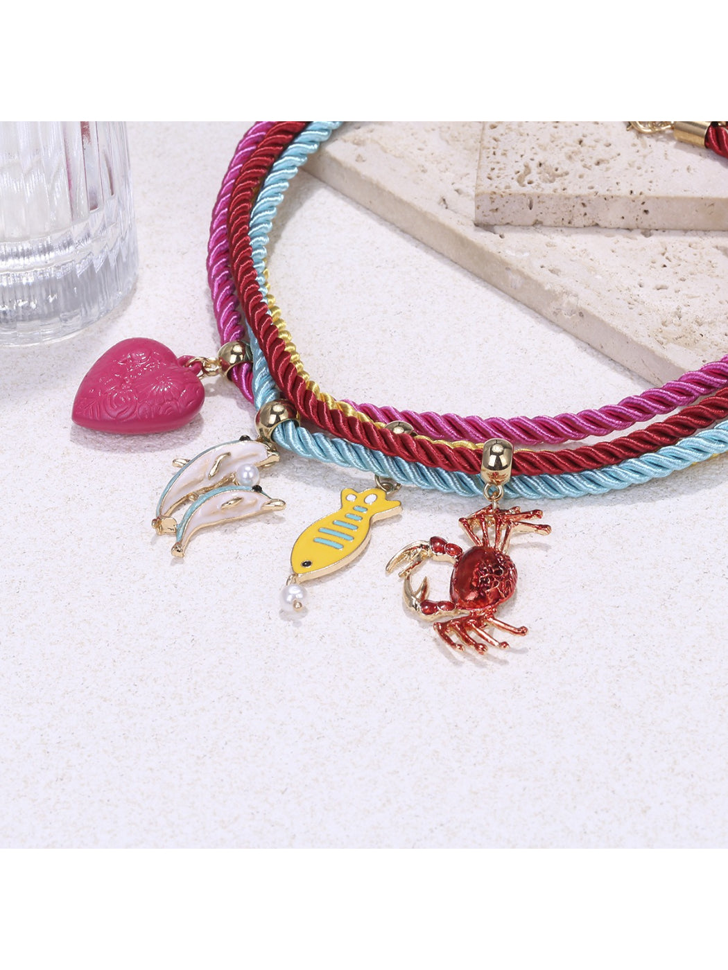 Neckit colorful rope necklace with ocean charms arranged in a circular shape