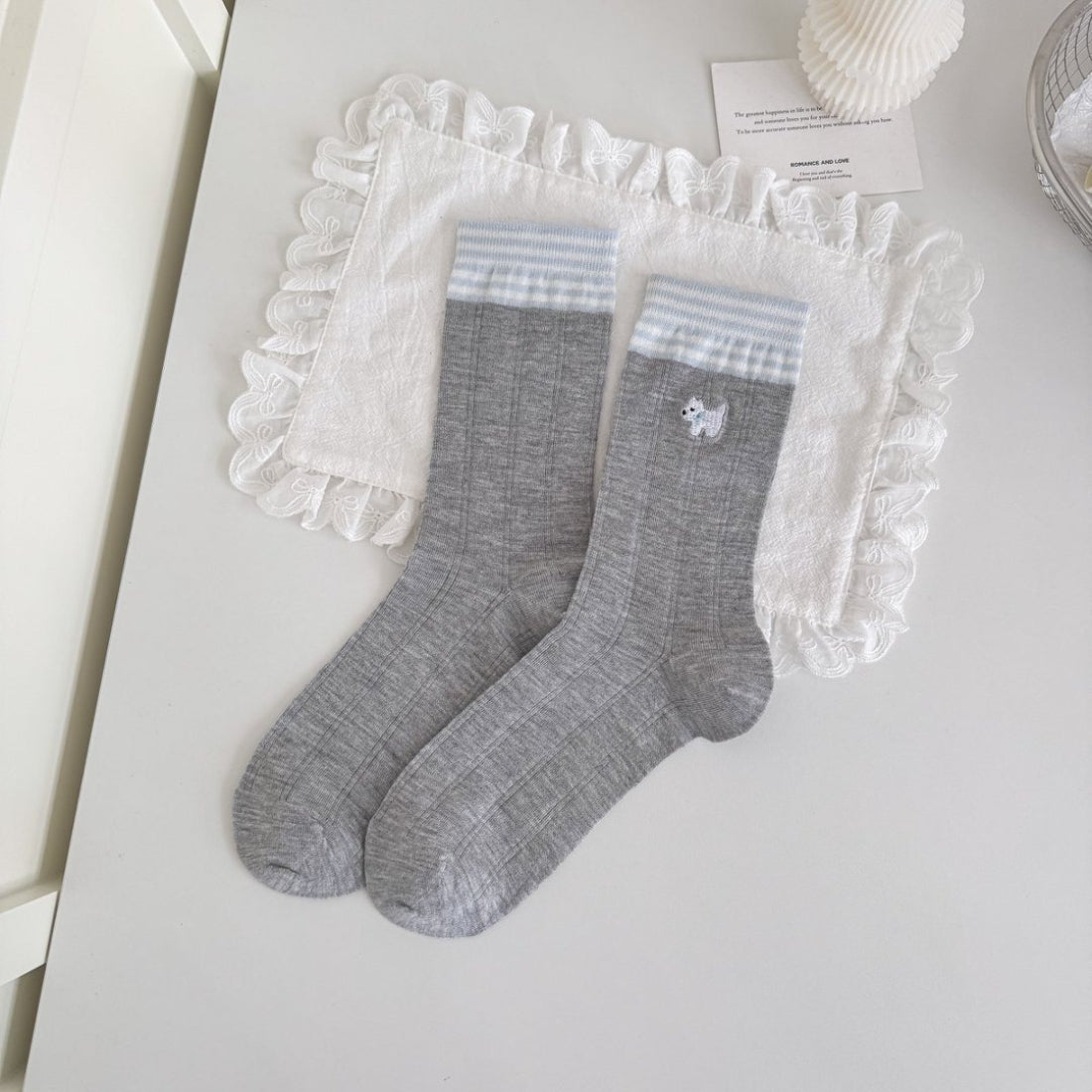 Side view of Rufia blue tone crew socks highlighting ribbed cuff