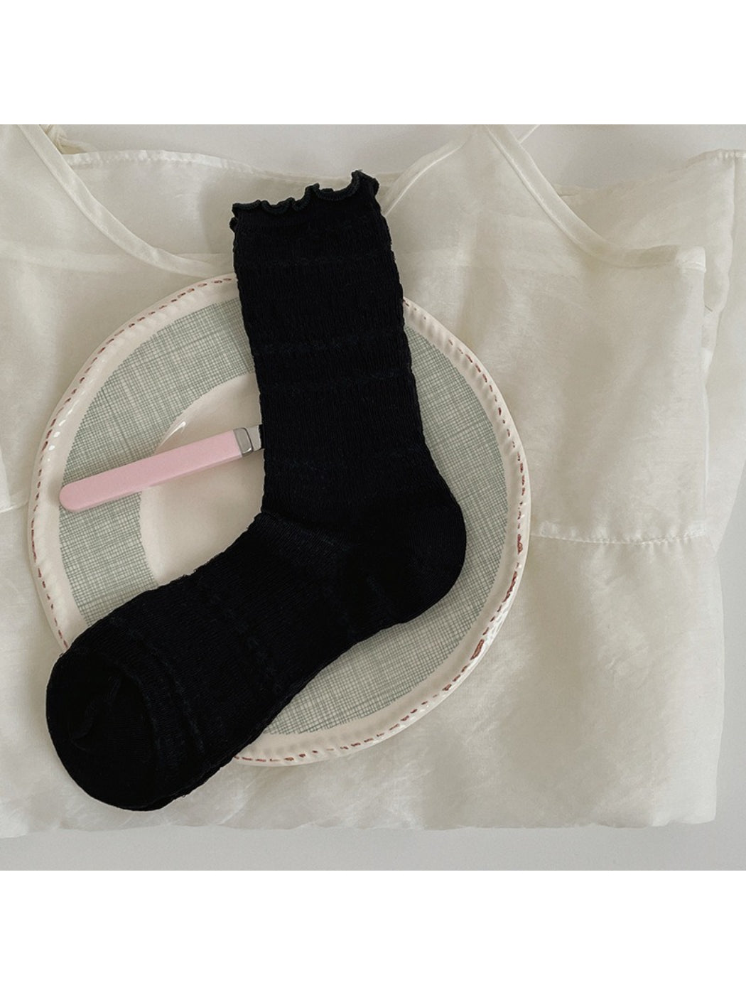 Rufia Sweet Ruffle Edge Socks packaged in branded box with clear view of ruffle edges