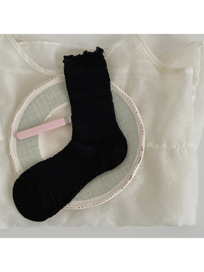 Rufia Sweet Ruffle Edge Socks packaged in branded box with clear view of ruffle edges