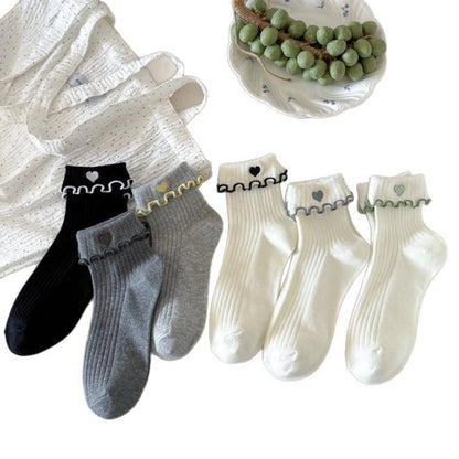 Rufia heart socks displayed flat highlighting cuff detail and pattern