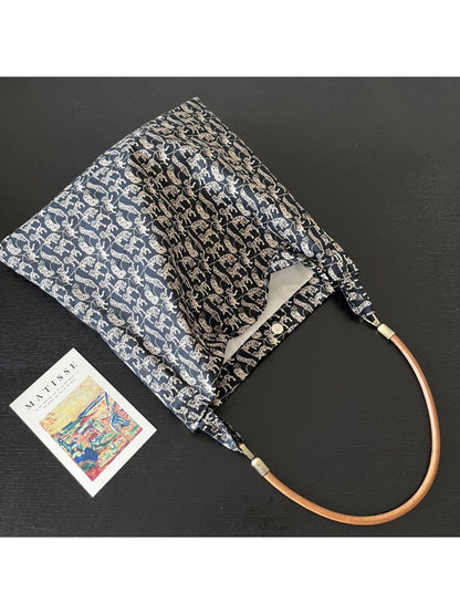 Cosbai black shoulder bag displayed on white background with black cat print