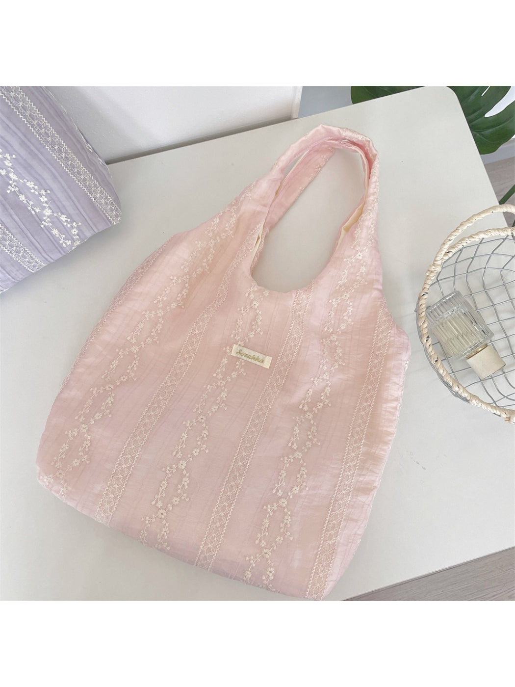 Side angle of Cosbai Soft Stripe Floral Shoulder Bag showing strap and pattern details