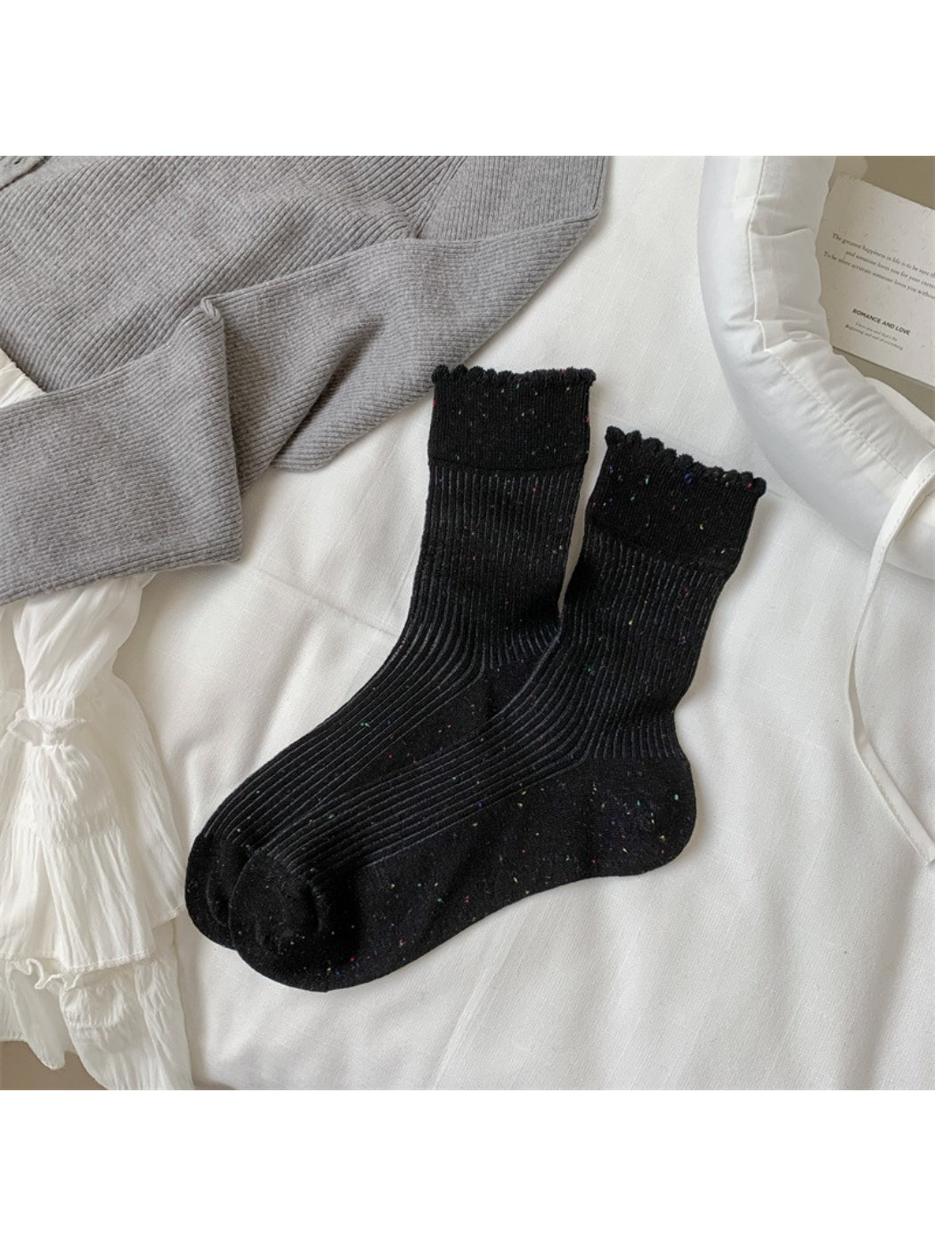 Side view of Rufia rib crew socks displaying ribbed cuff and speckled knit pattern