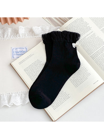Rufia ruched ankle socks styled with casual sneakers on model
