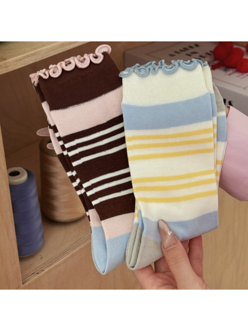 Close-up of the wavy cuff detail on Rufia striped socks