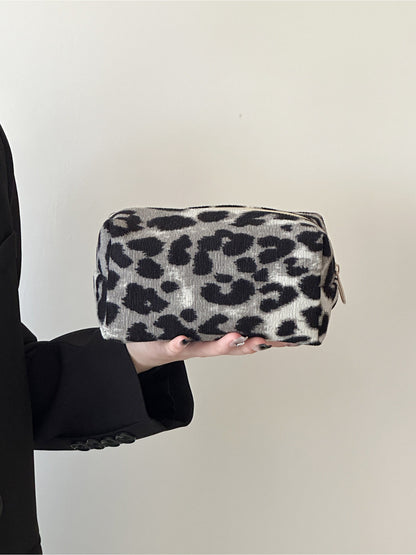 Side view of Cosbai leopard print travel makeup bag highlighting shape and design