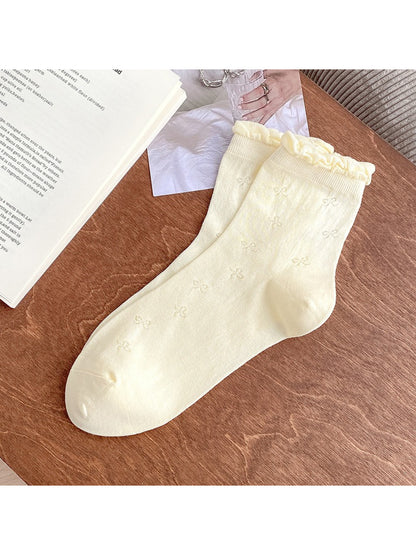 Rufia Sweet Bow Knit Crew Socks in cream color with bow accent