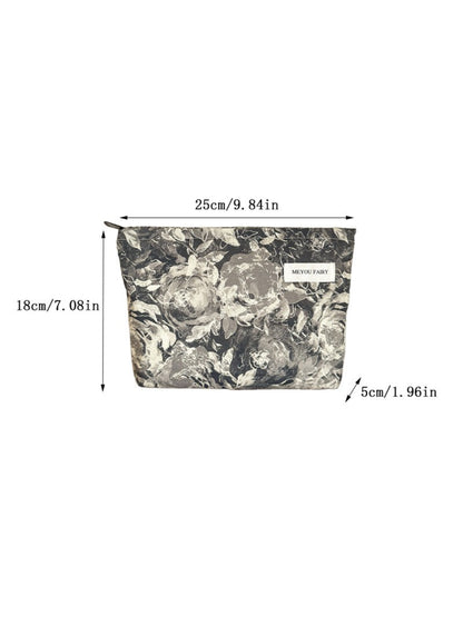 Cosbai floral makeup bag placed on a white surface with lighting