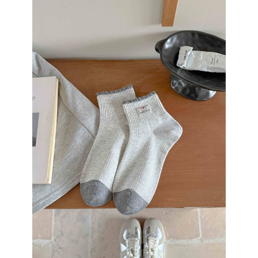 Rufia contrast toe ribbed ankle socks folded neatly on wooden surface
