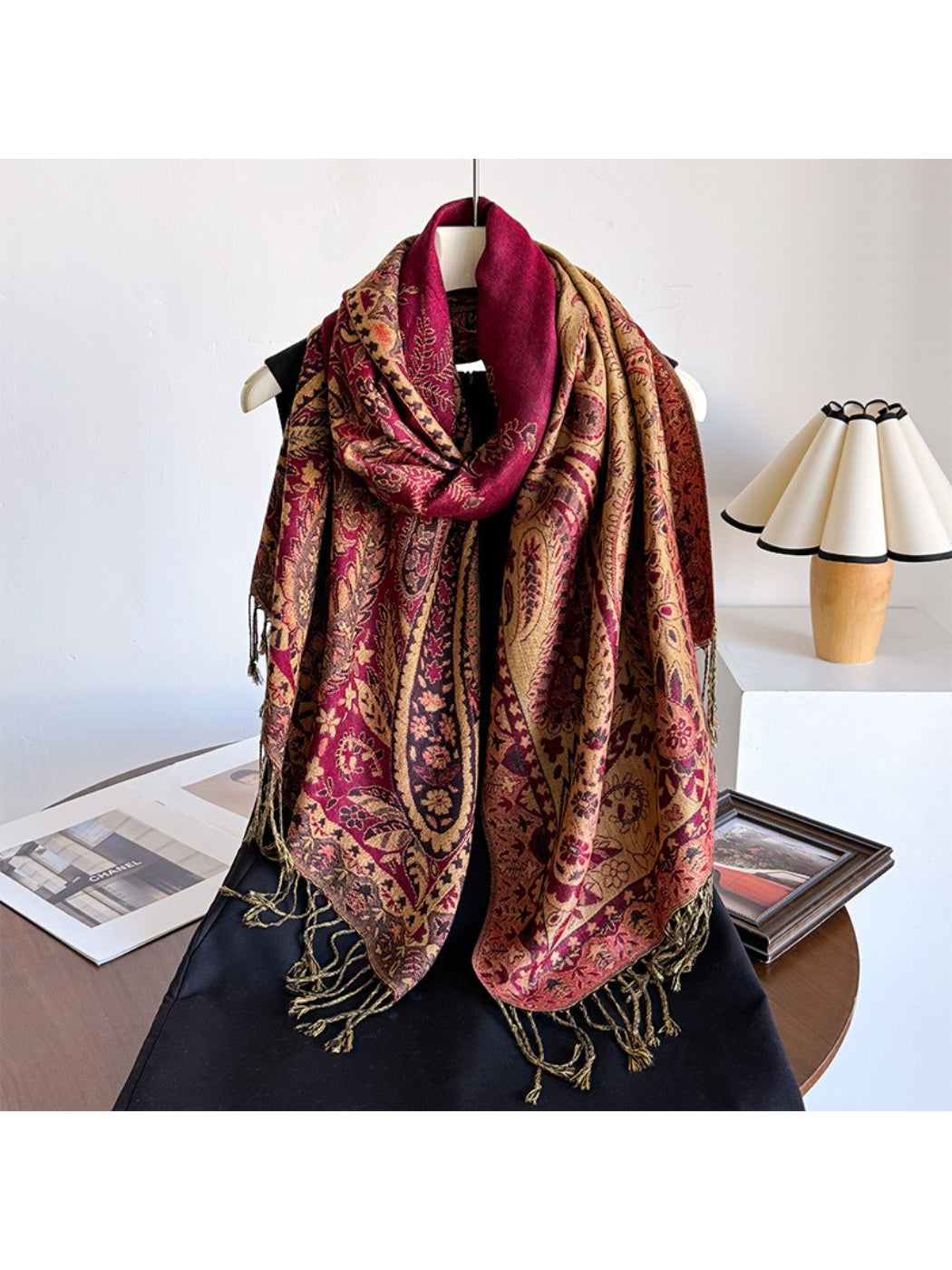 Close-up of scarf fabric highlighting intricate paisley design and tassel details