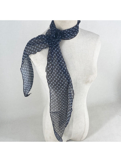 Model wearing vintage polka dot rose neck scarf styled with casual outfit