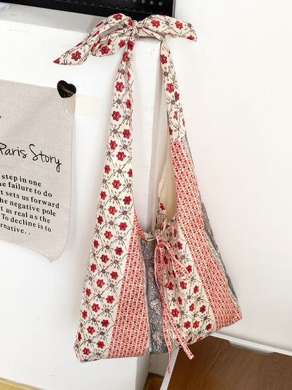 Cosbai boho tote bag placed on wooden surface with lighting