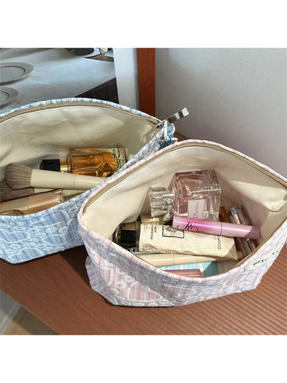 Cosbai cosmetic pouch displayed with matching heart print accessories