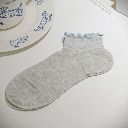 Pair of Rufia Nordic Heart Frill Crew Socks styled with casual footwear and outfit