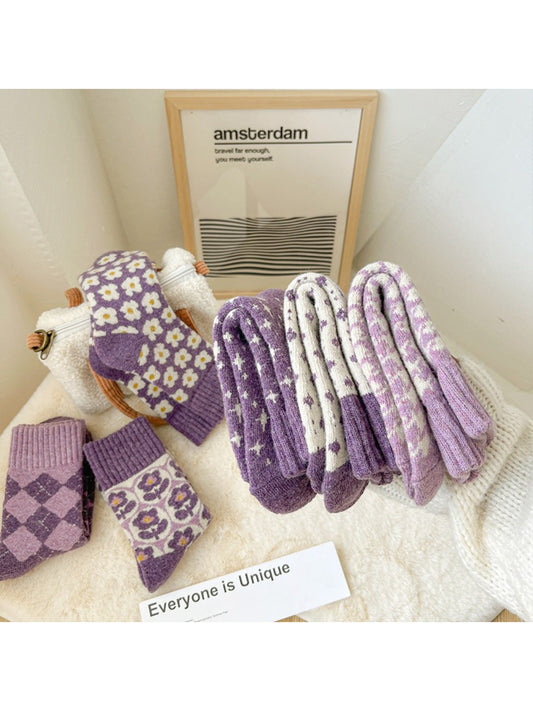 Rufia purple patterned crew socks arranged with card