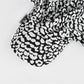 Back view of Haila black and white leopard print baseball cap with strap