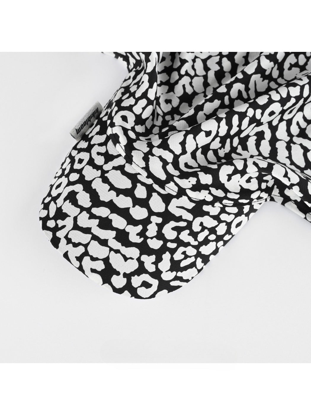 Back view of Haila black and white leopard print baseball cap with strap