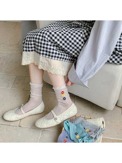 Rufia Sweet Flower Detail Crew Socks worn with casual shoes and rolled-up jeans