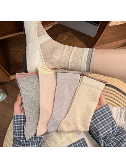 Rufia ribbed socks folded neatly showing fabric texture