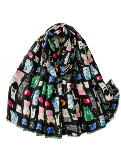 Model wearing Scarvii colourful cat sketch scarf draped around neck