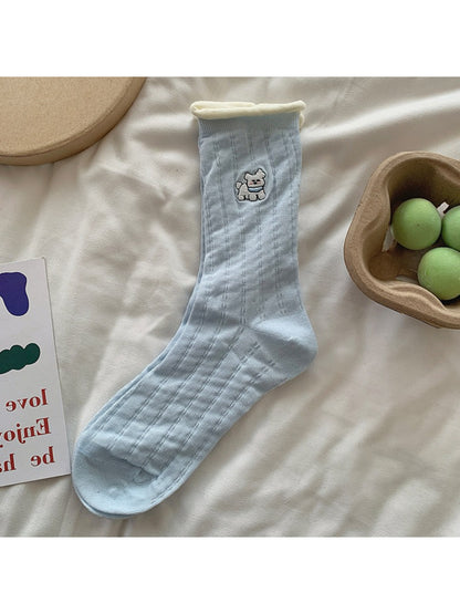 Rufia character socks laid flat to show full design and roll cuff detail