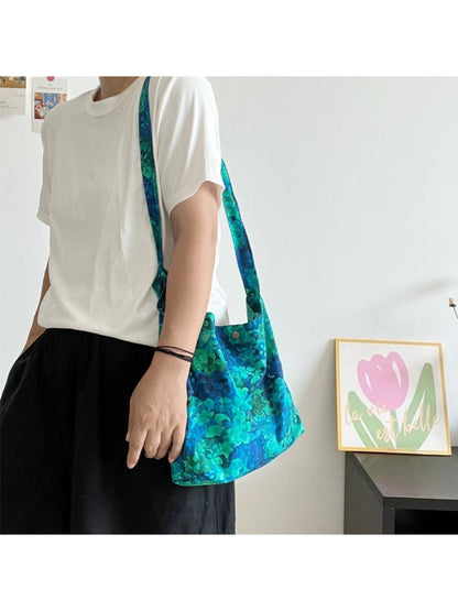 Cosbai blue floral tie shoulder bag displayed with matching accessories