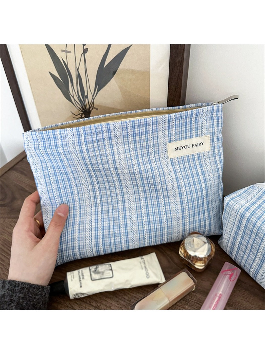 Close-up of Cosbai blue check cosmetic bag showing fabric pattern and texture