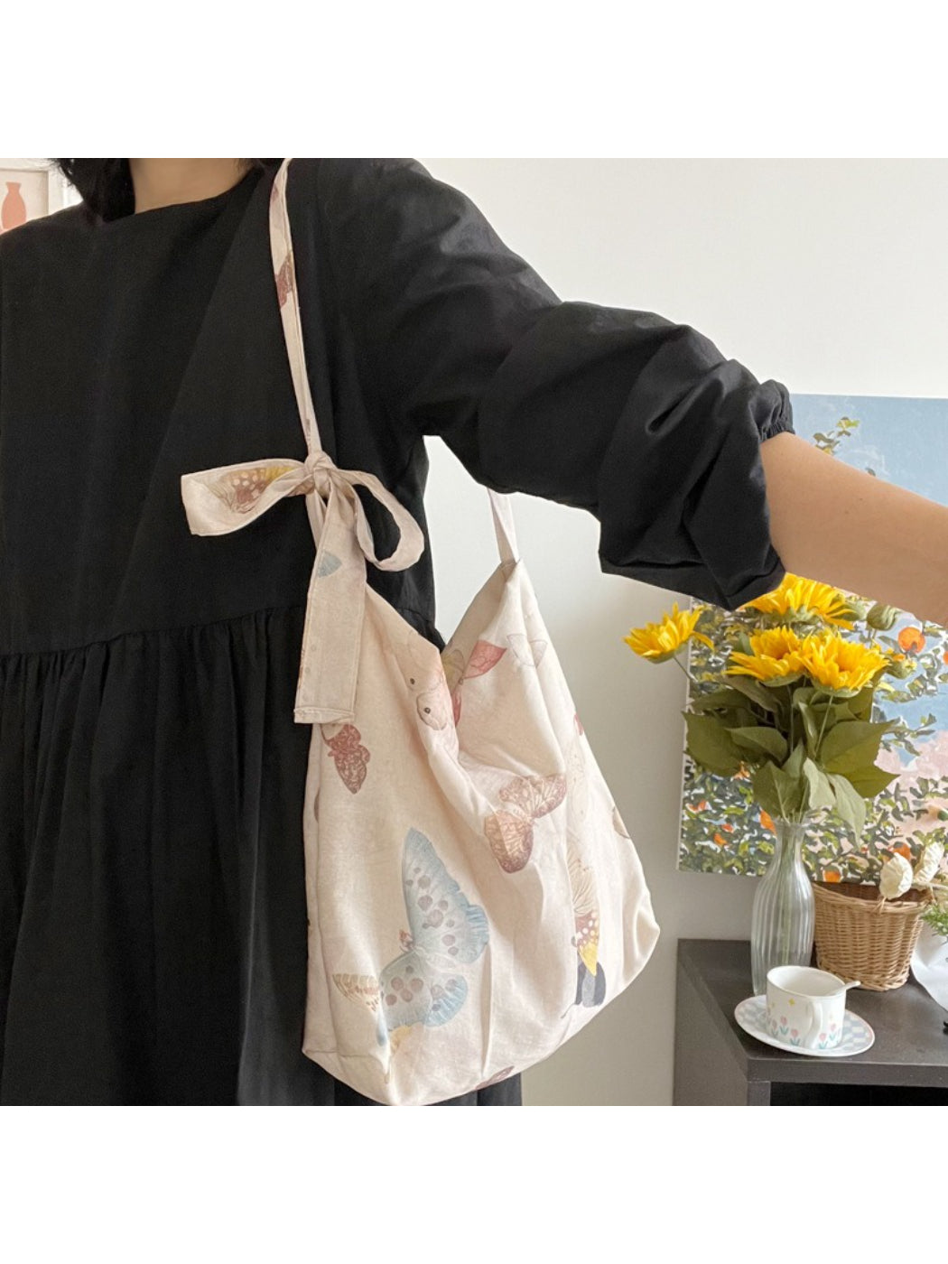 Interior view of Cosbai butterfly print shoulder bag showing lining and pocket