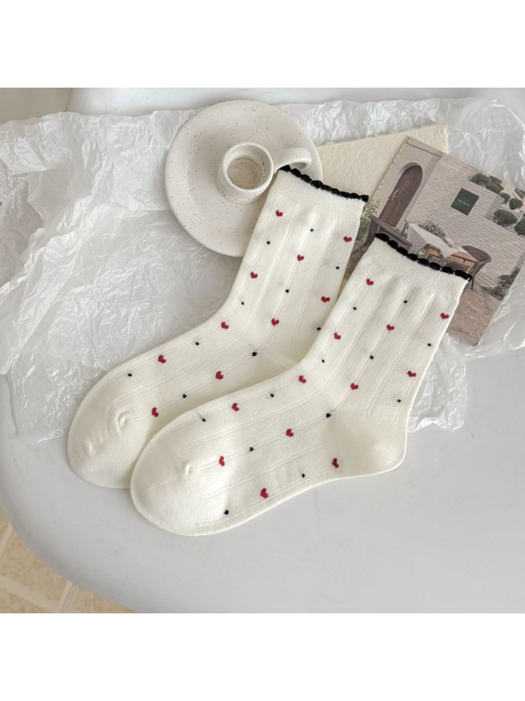 Rufia socks worn on feet, highlighting lace trim and mixed motifs