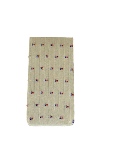 Rufia tiny floral sheer tights folded neatly on a white surface