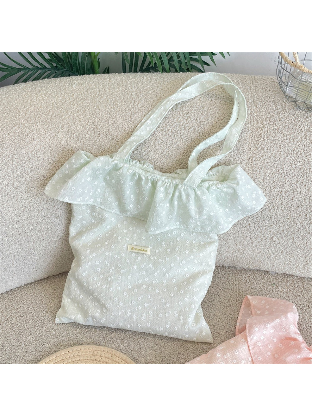 Cosbai Tiny Floral Ruffle Tote Bag held by hand displaying compact size and floral design
