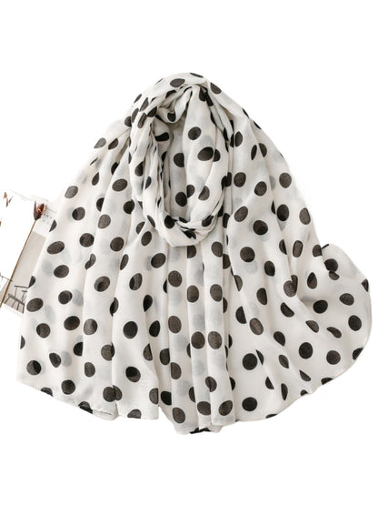 Scarvii Everyday Polka Dot Scarf styled with a jacket and sunglasses outdoors